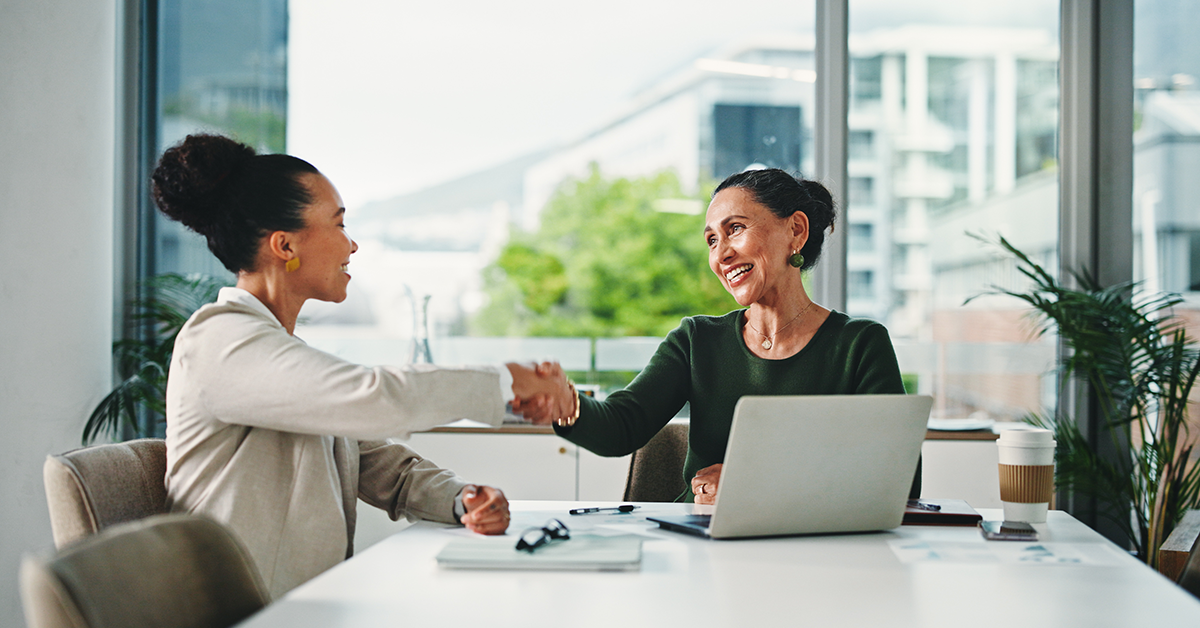Hiring manager, shaking hands with new employee