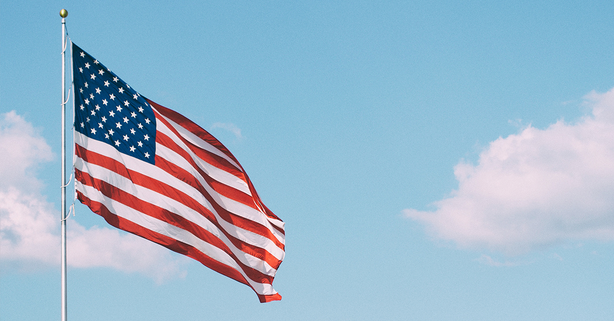 American Flag waving in the breeze against the sky