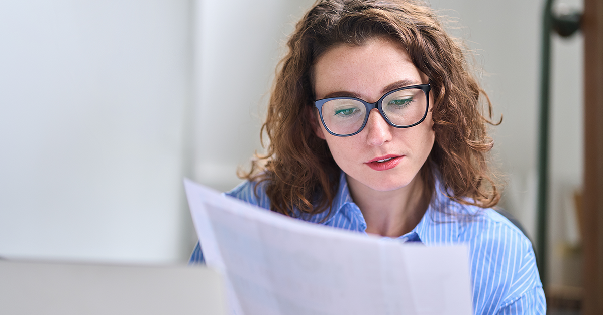Young business woman reviewing pay data trends