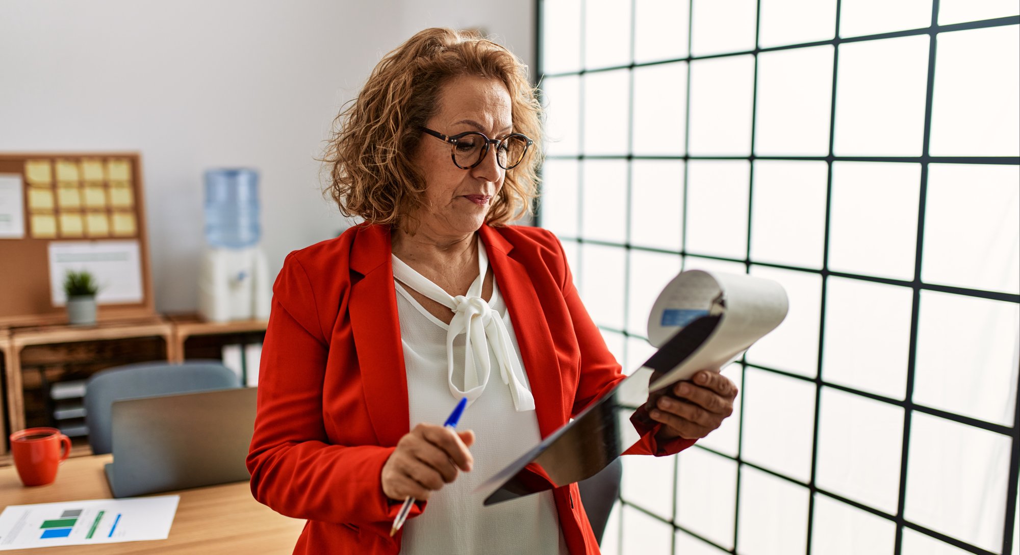 Woman in red with clipboard