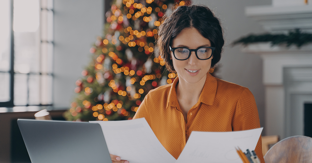 Smiling woman employee, working in office during christmas time