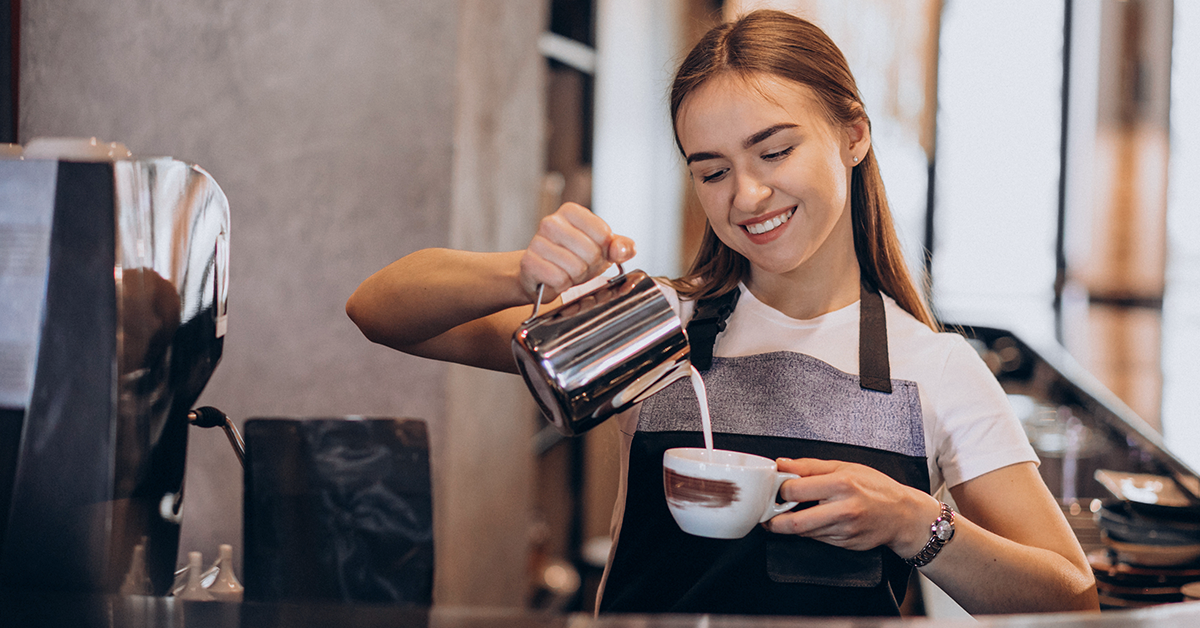 female barista working in a coffee shop