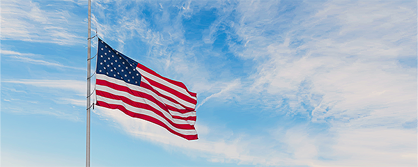 American flag in a sunset sky background