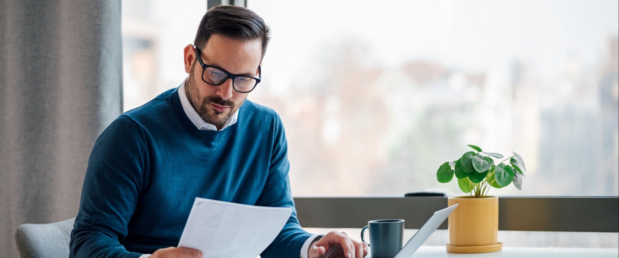 A man studies a document