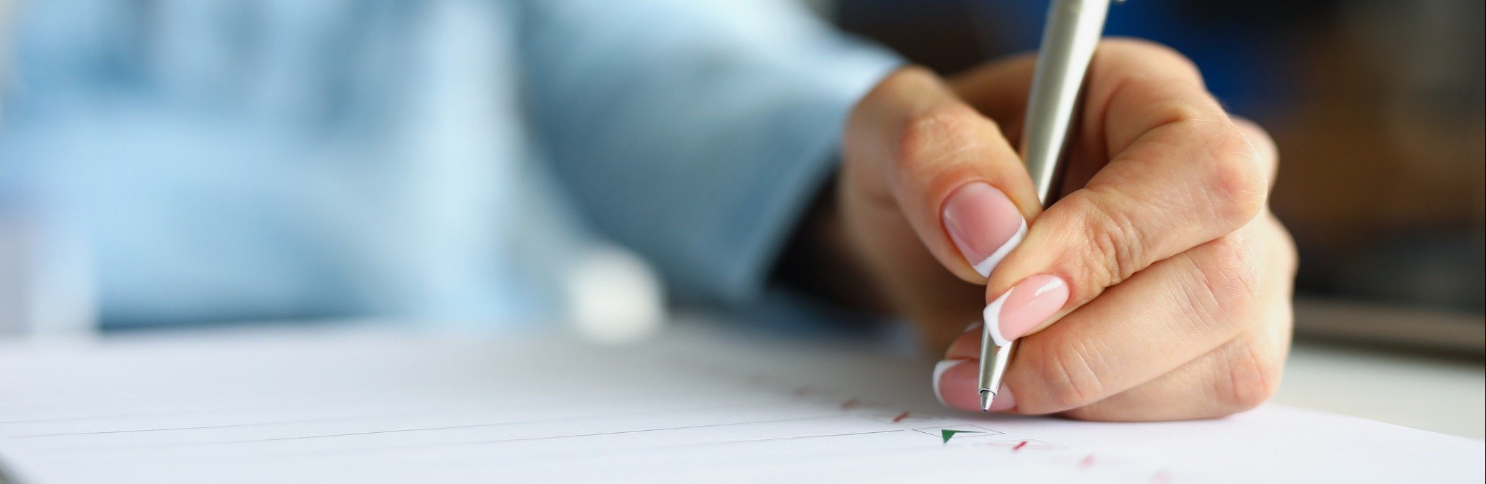 A hand checking off a list.