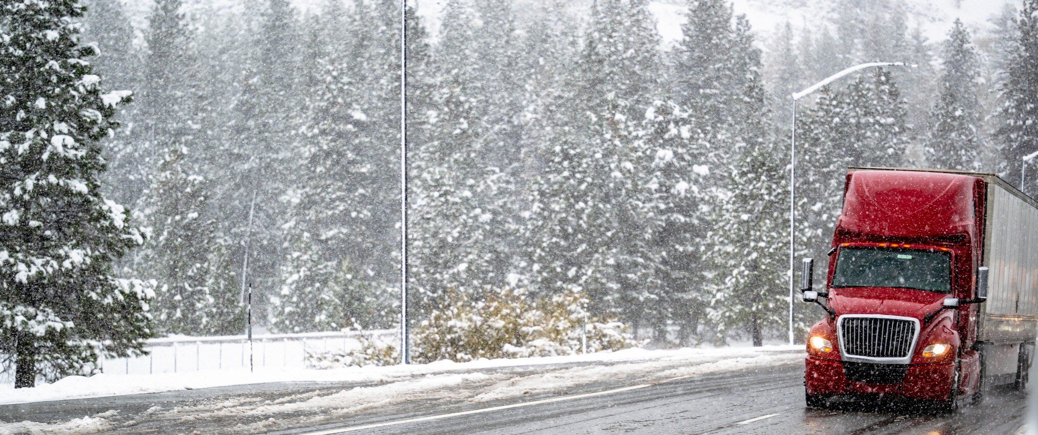 A truck driving in bad weather.