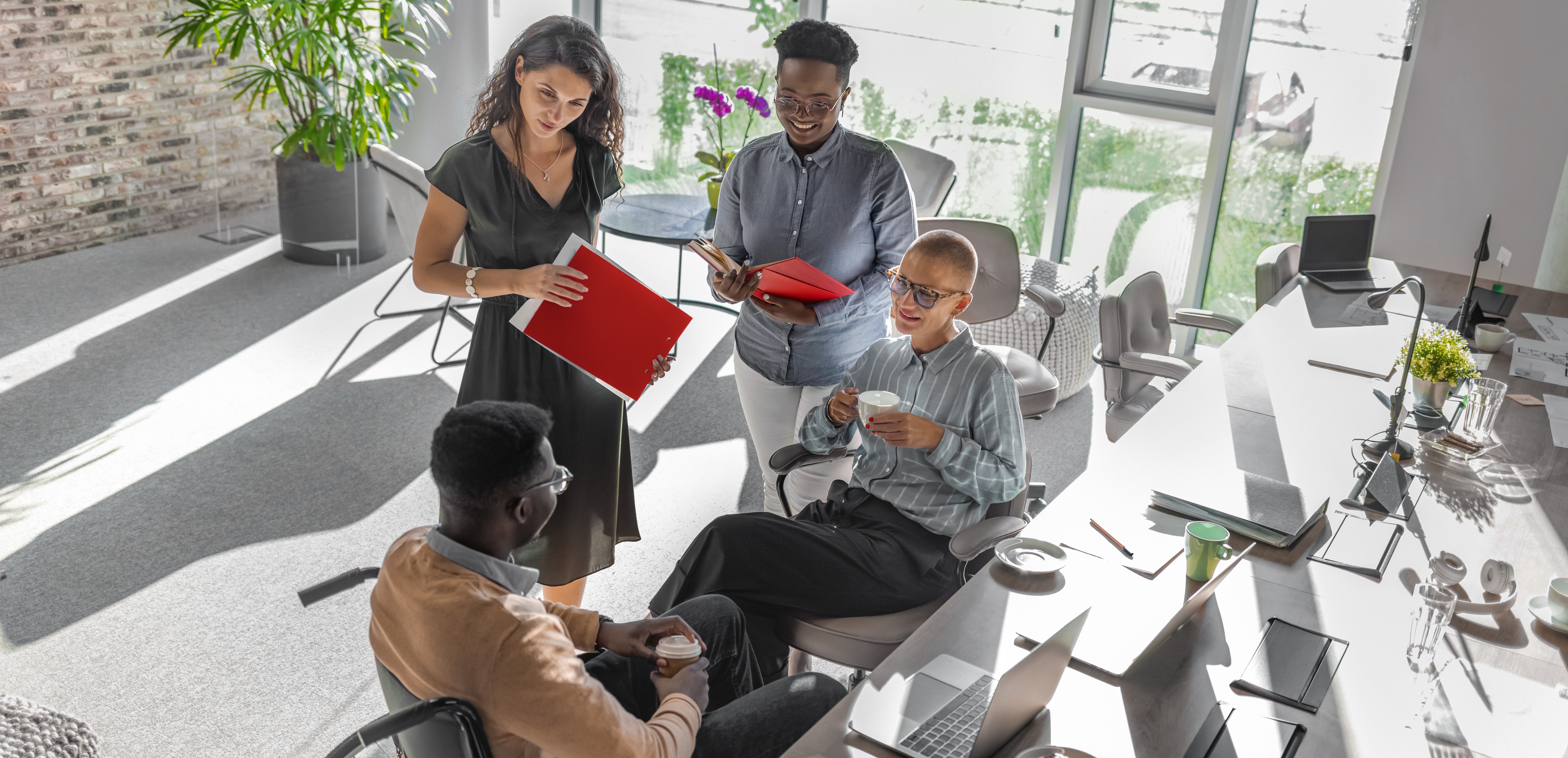 Four coworkers working in an office.