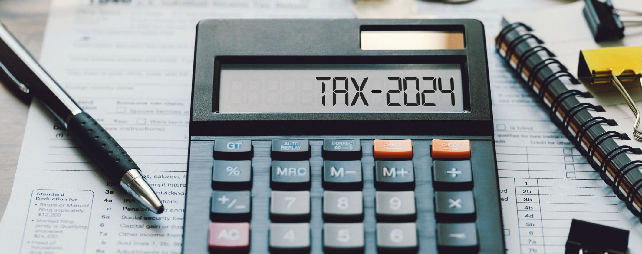 Calculator stating the words, "Tax - 2024"