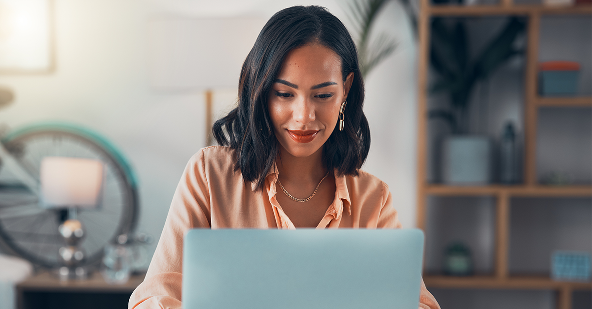 Business woman using a laptop in an office